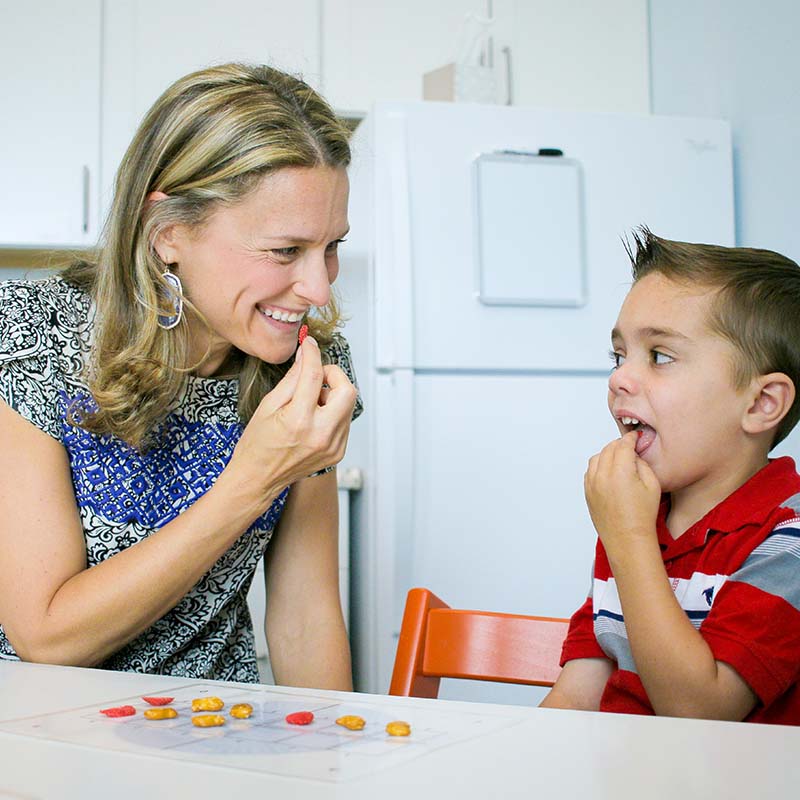 Therapist working with child during feeding therapy session